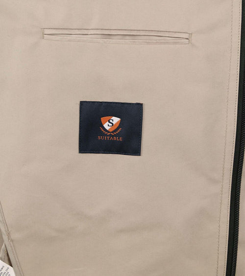 Suitable regenjas beige